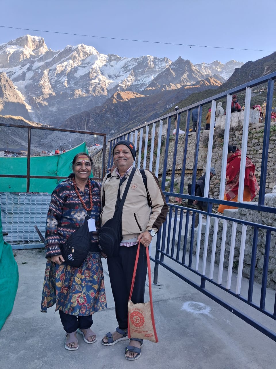 Pilgrims at Kedarnath with snow-capped Himalayas